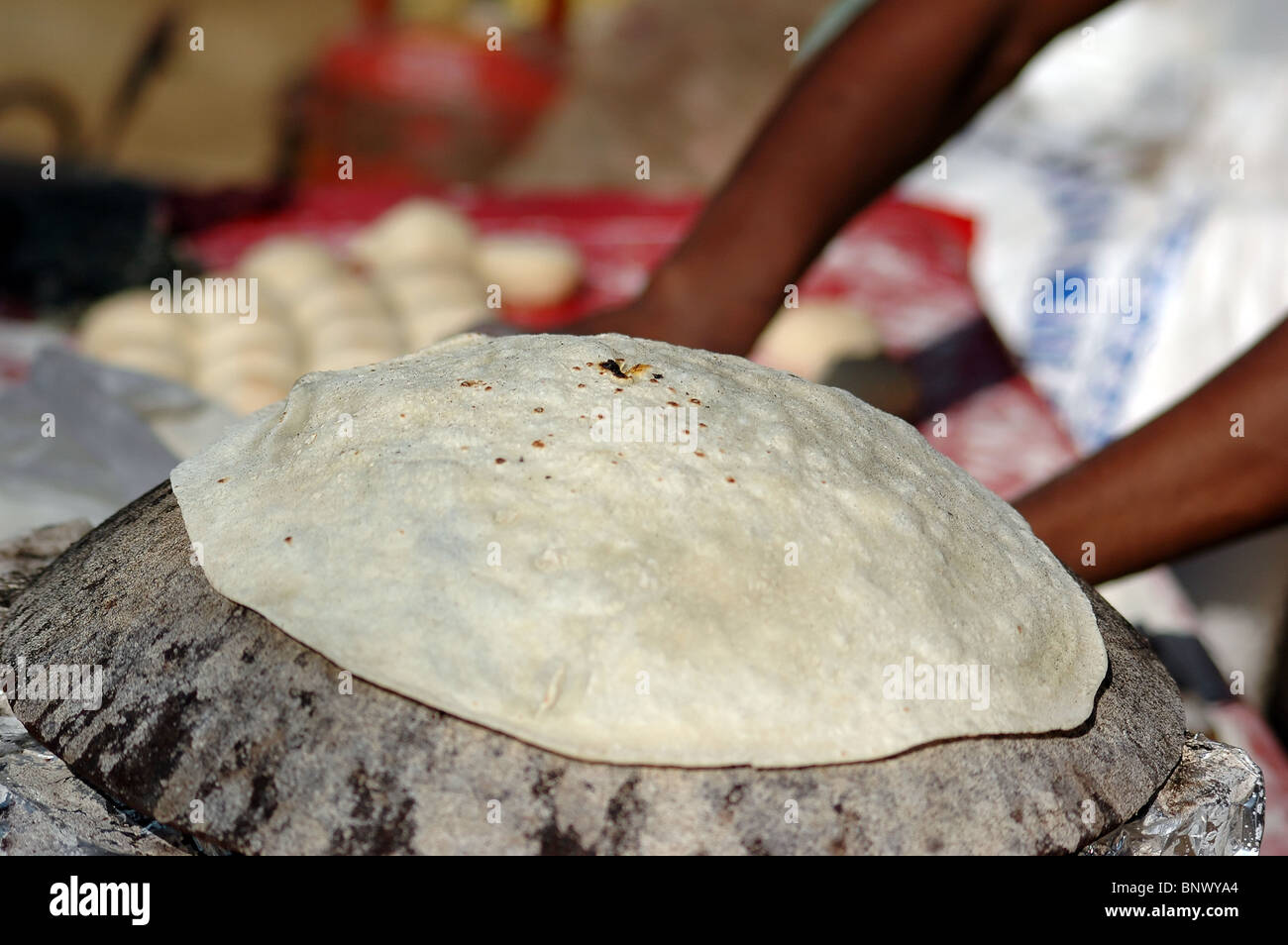 Cooking local/regional cuisine - Roomali Roti (a type of pancake bread) Stock Photo