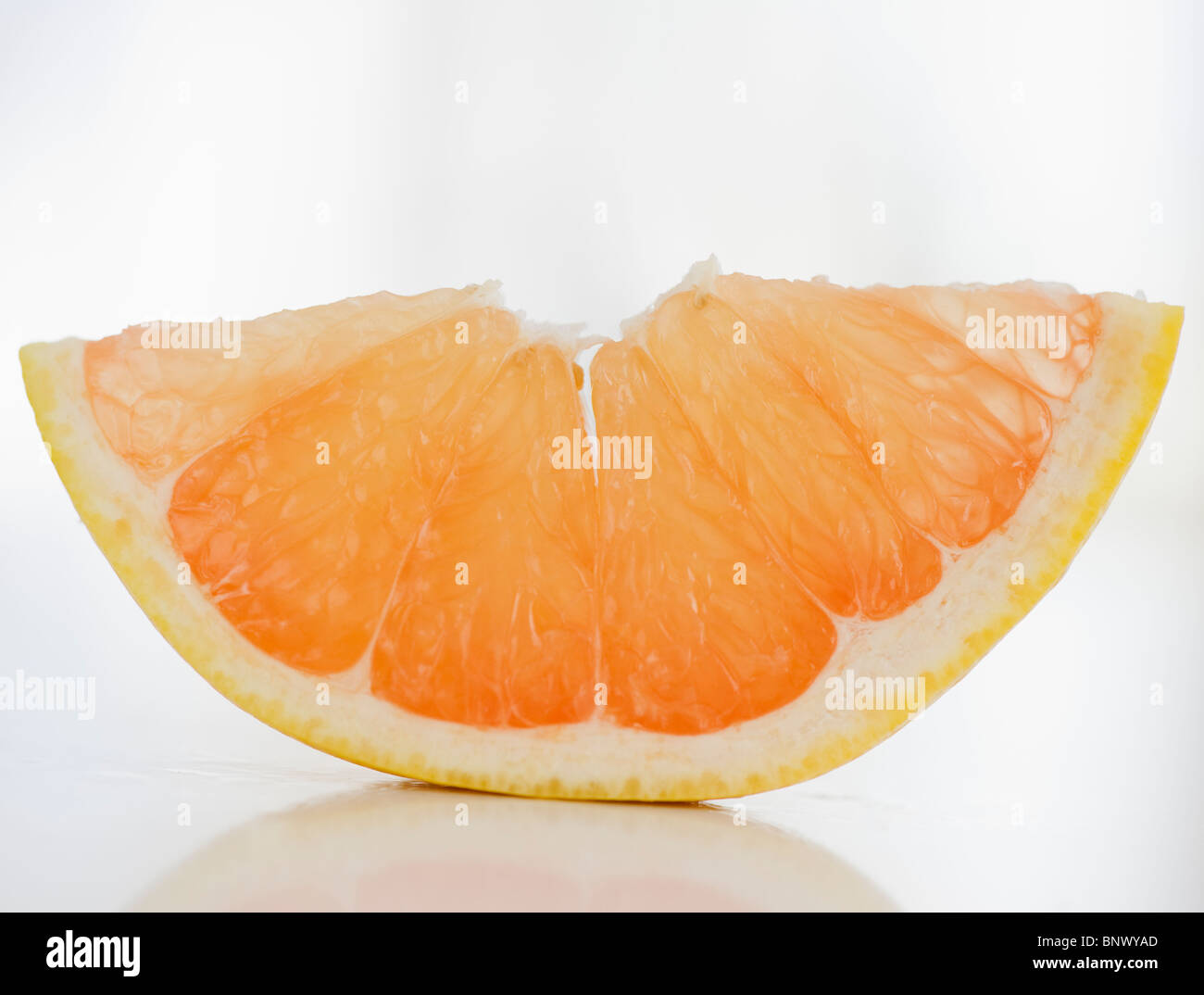 Slice of fresh grapefruit Stock Photo