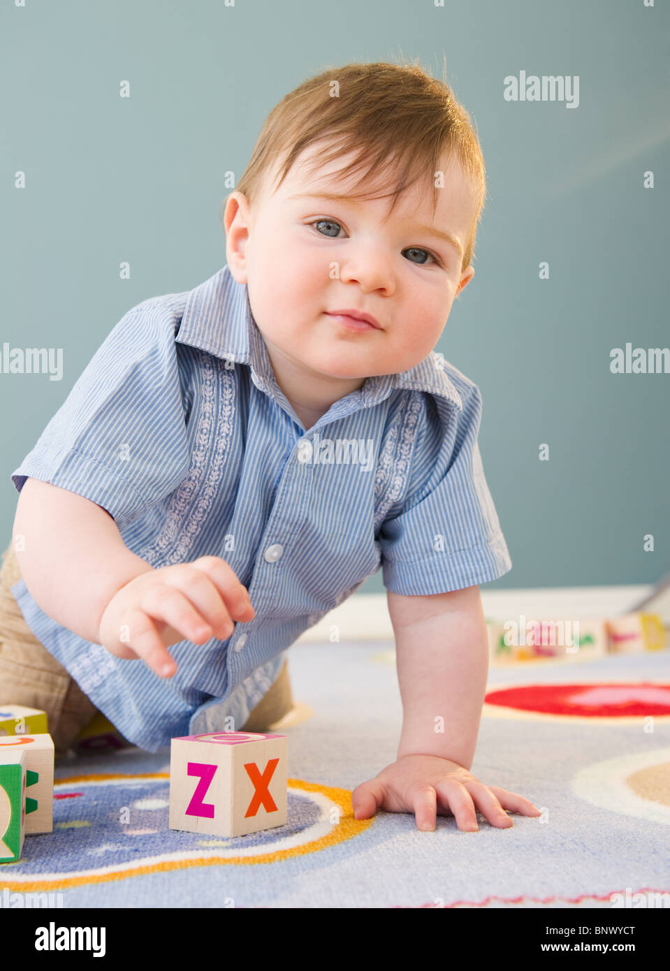 Baby with building blocks babies hires stock photography and images