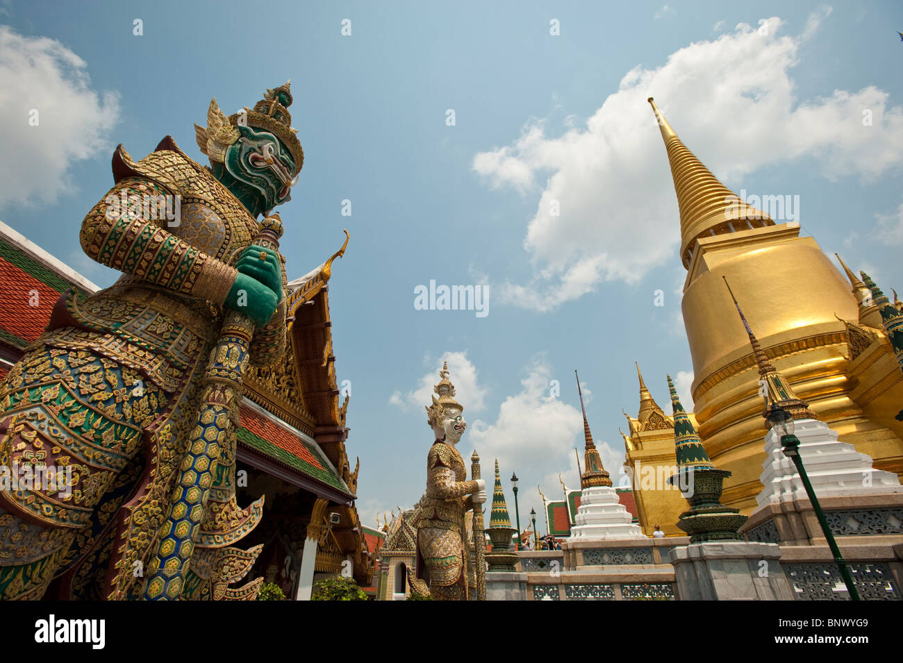 Sculptures and golden chedi at the Grand Palace, Bangkok, Thailand