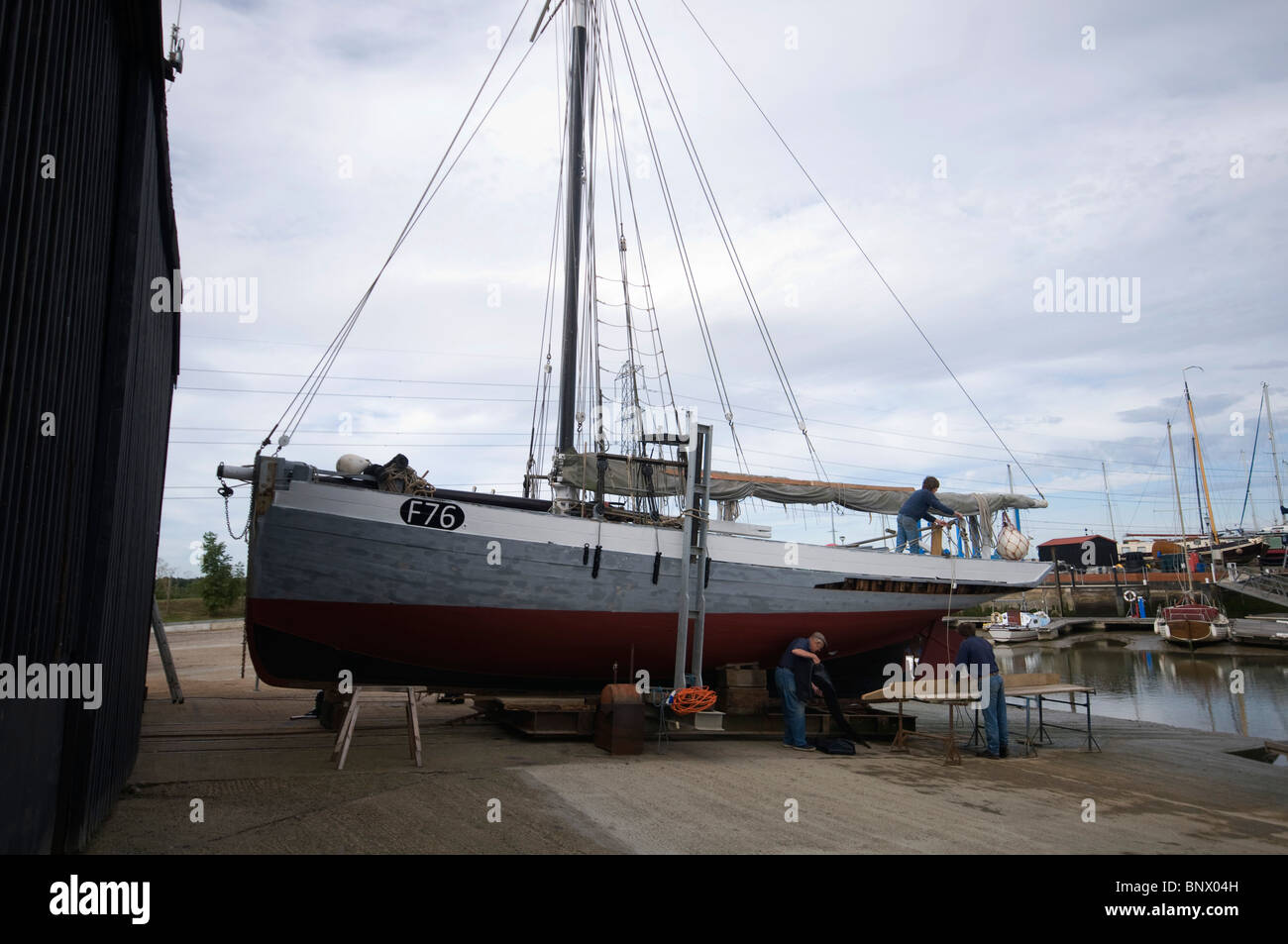 Oyster Yawl the Gamecock built in 1907 under repair having a plank  replaced by steaming in a bag to aid in bending the wooden Stock Photo