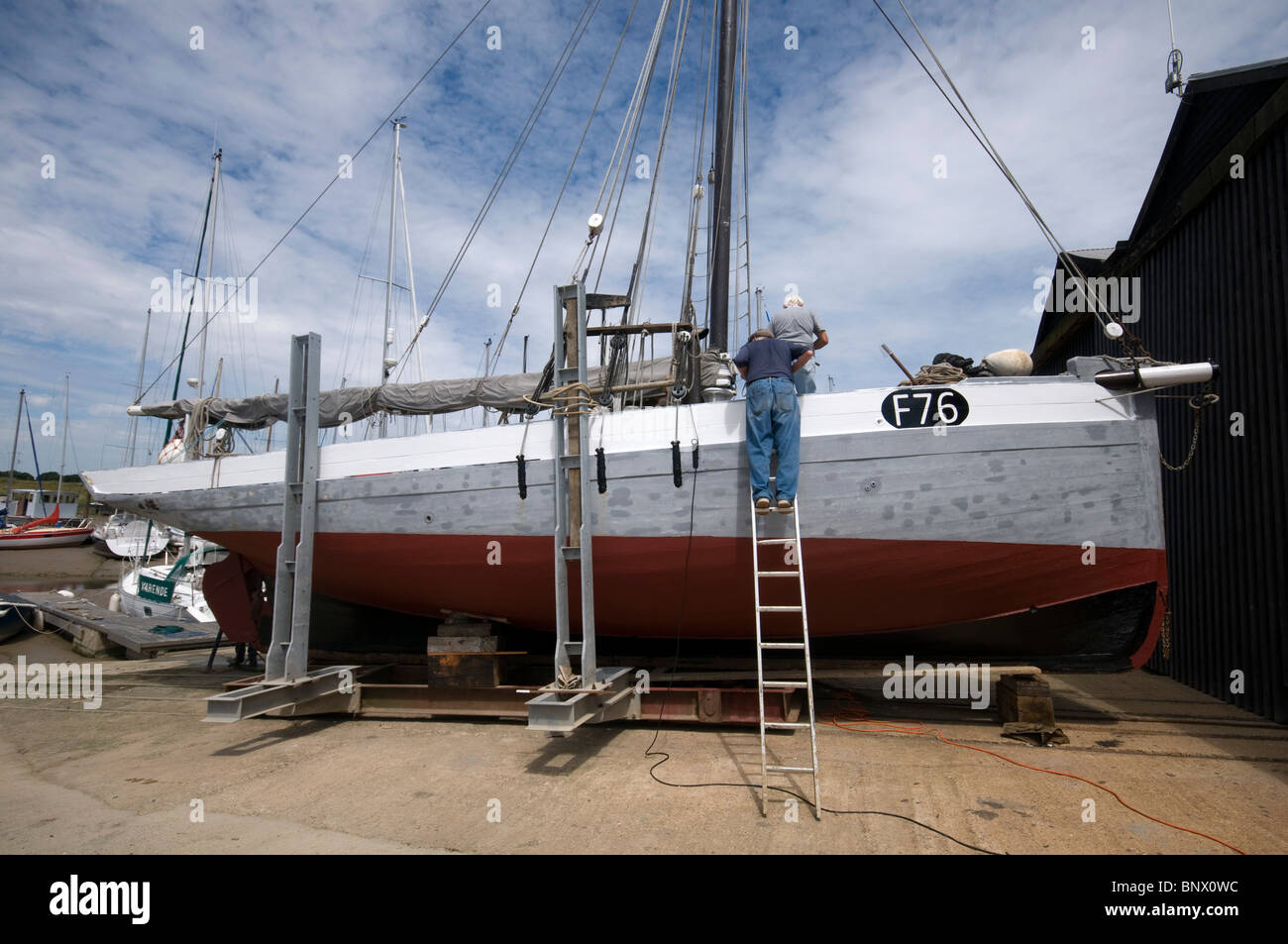 Oyster Yawl the Gamecock built in 1907 under repair having a plank replaced by steaming in a bag to aid in bending the wooden Stock Photo