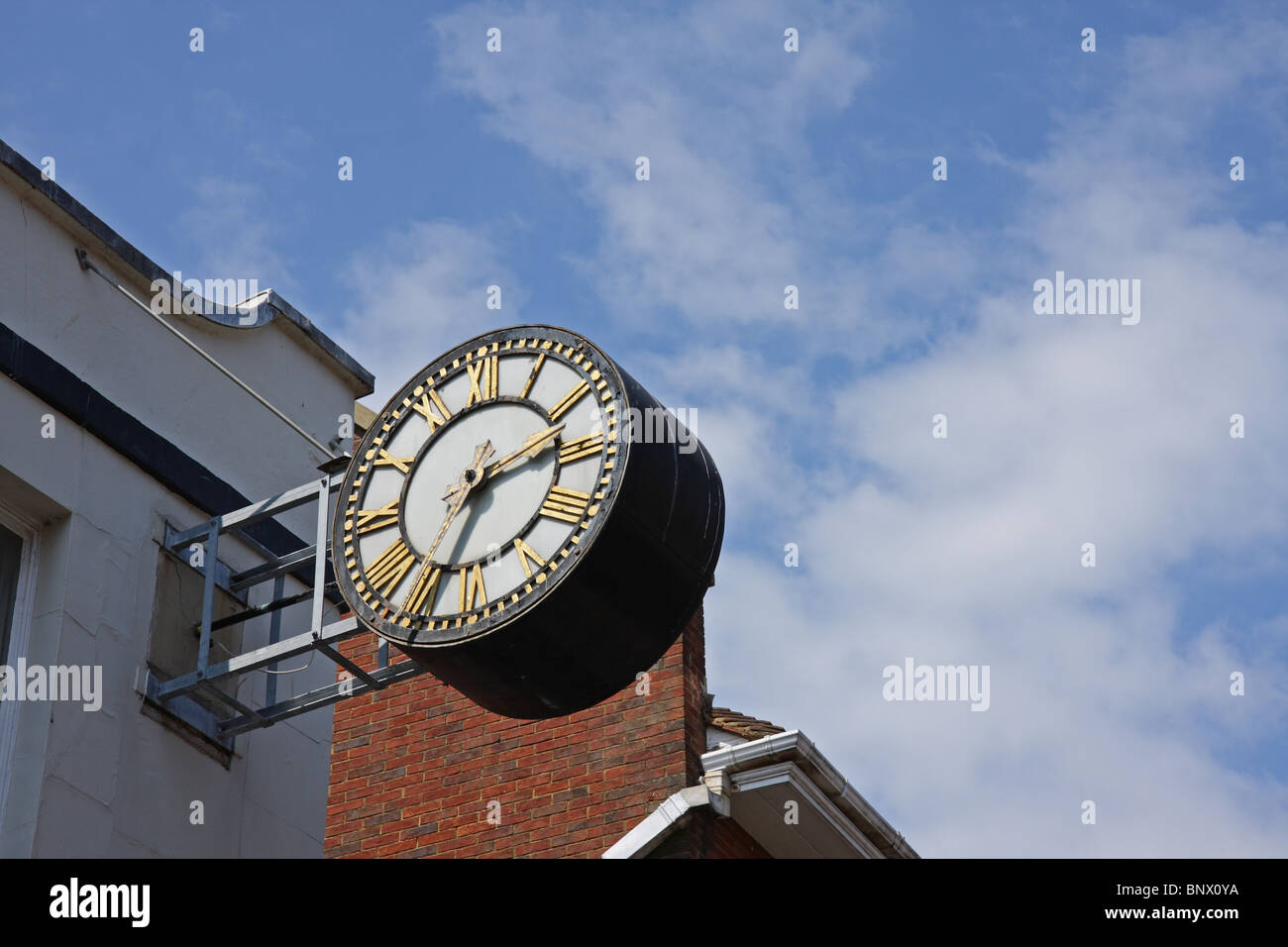 Street clock against blue sky Stock Photo