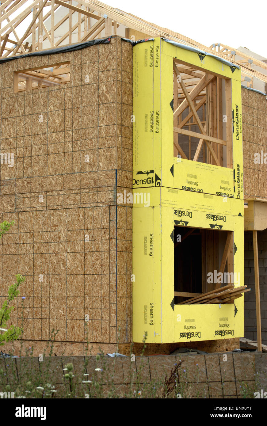 Construction site for town houses showing foundation and wood framing. Stock Photo