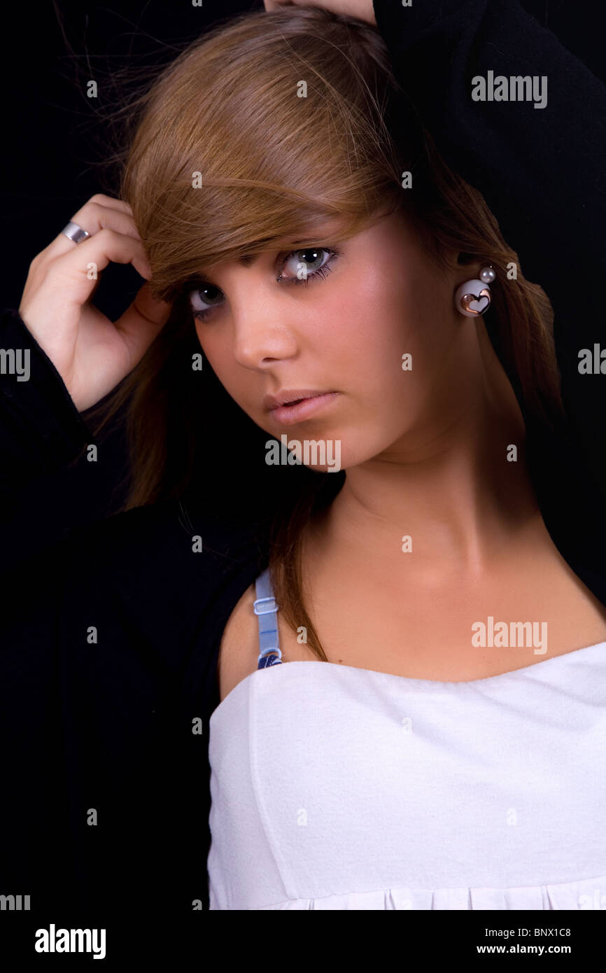 young beautiful girl portrait against black background Stock Photo - Alamy