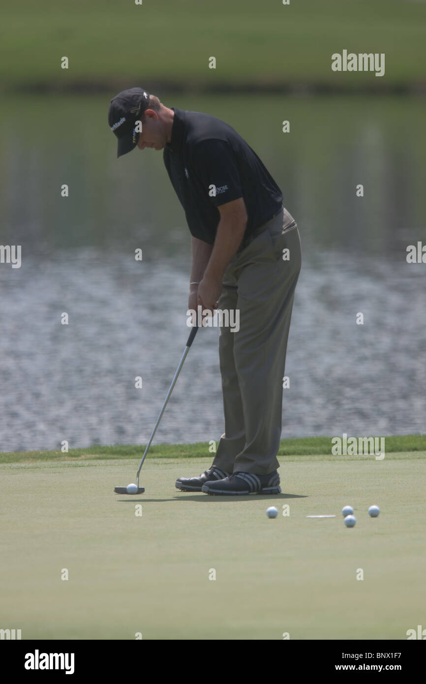 Retief Goosen practices putting on the 17th green during a practice round of the 2009 Players Championship. Stock Photo