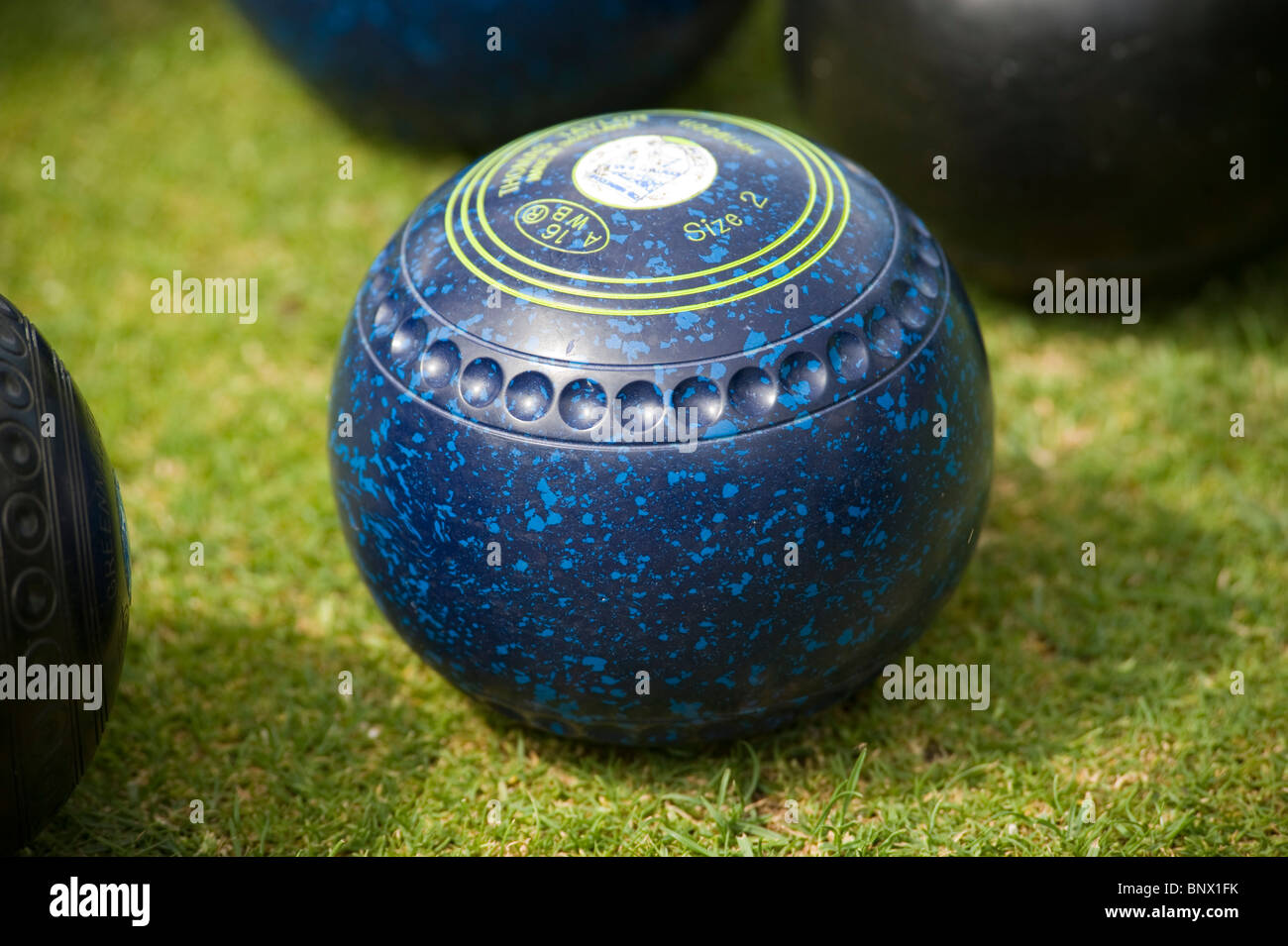 A bowl in a game of outdoor lawn bowls Stock Photo