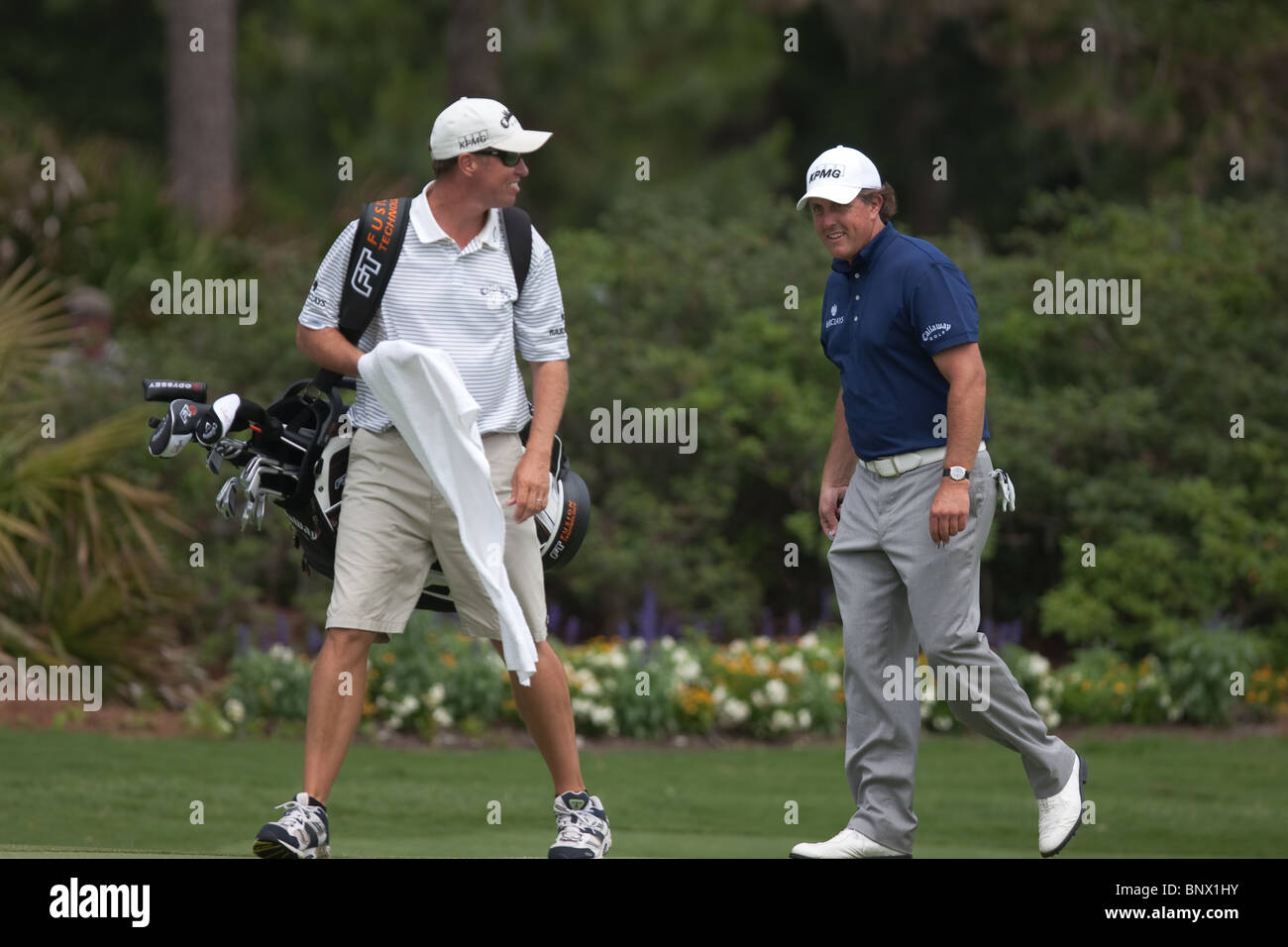 Phil Michelson and caddie Jim "Bones" MacKay walk to the green of the