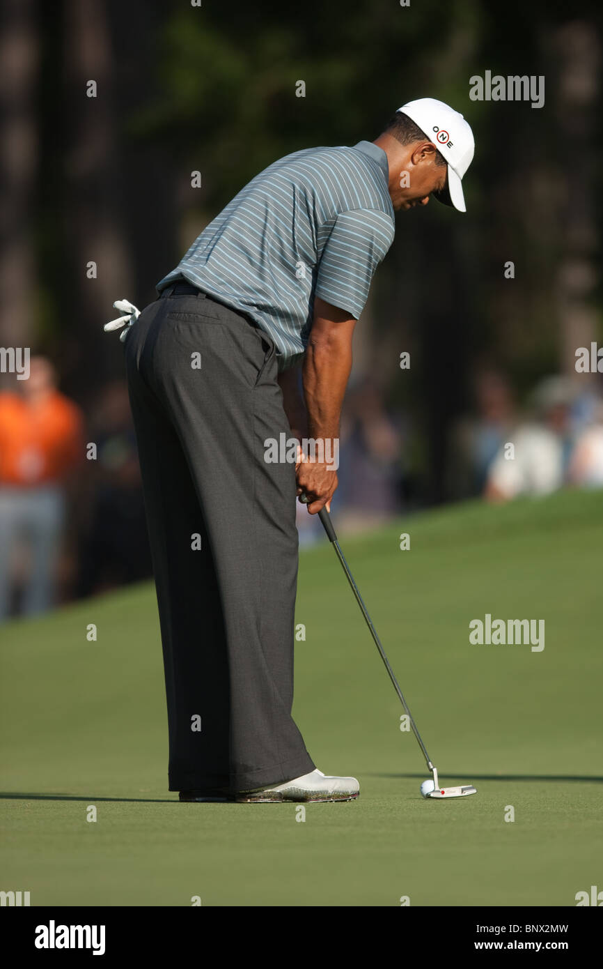 Tiger Woods putts on the green of the par 3 8th hole during a practice round of the 2009 Players Championship. Stock Photo