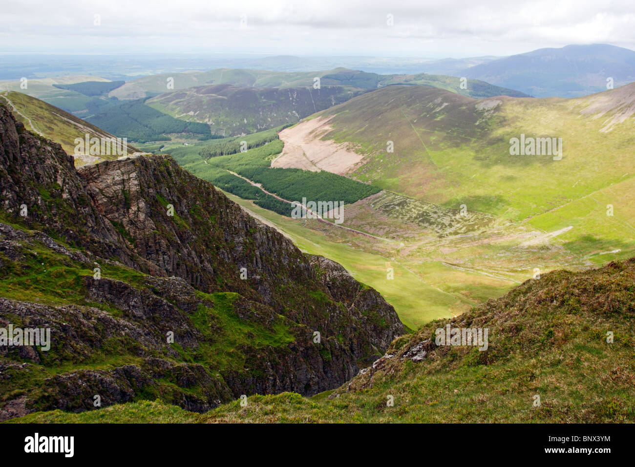 Looking down from Hobcarton Crag on Hopegill Head towards Grisedale Pike and Whinlatter Forest in the Lake District, Cumbria. Stock Photo
