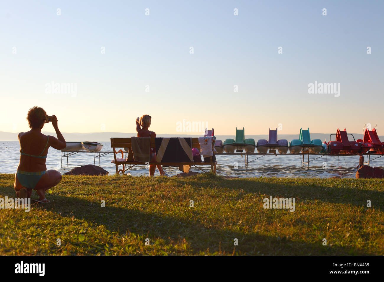 fun rental boat at lake Balaton during summer sunset, Hungary Stock