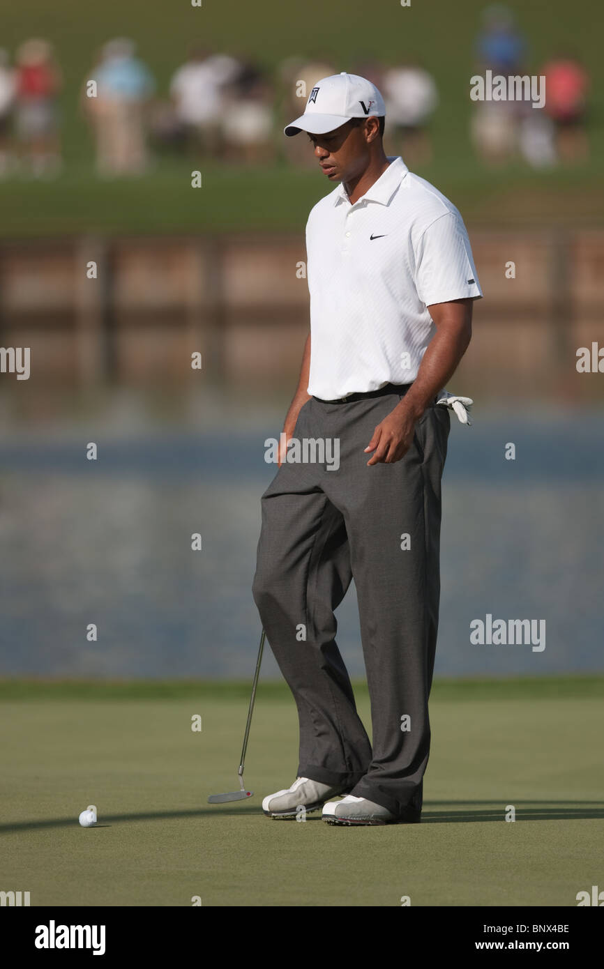 Tiger Woods approaches a putt on the 16th green during a practice round of the 2009 Players Championship. Stock Photo