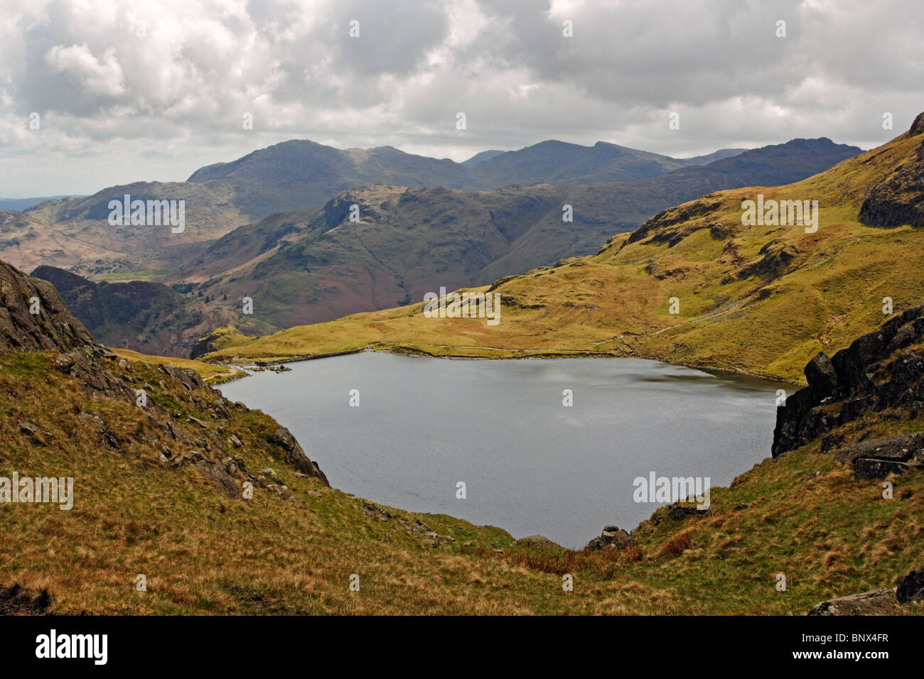 Stickle Tarn from between Pavey Ark and Harrison Stickle in the Lake District National Park, Cumbria. Stock Photo
