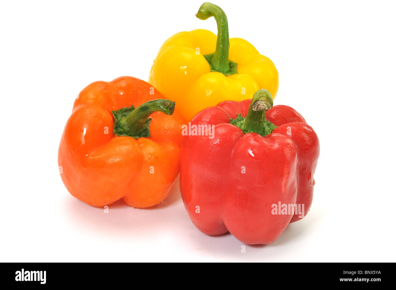 Three colorful bell peppers isolated on white background Stock Photo ...