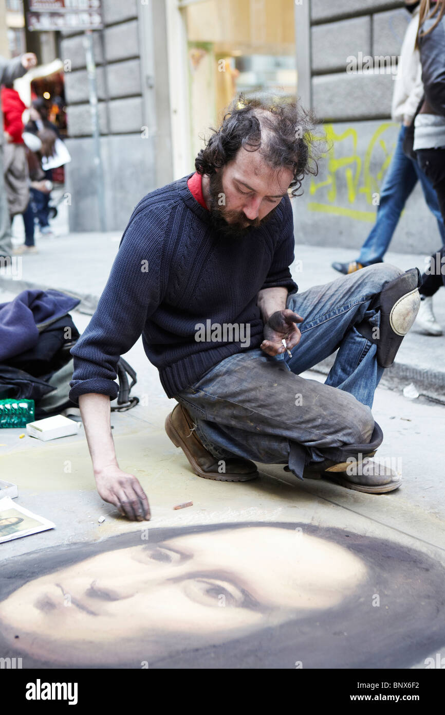 Street artist drawing the Mona Lisa on a pavement in Florence, Italy Stock Photo