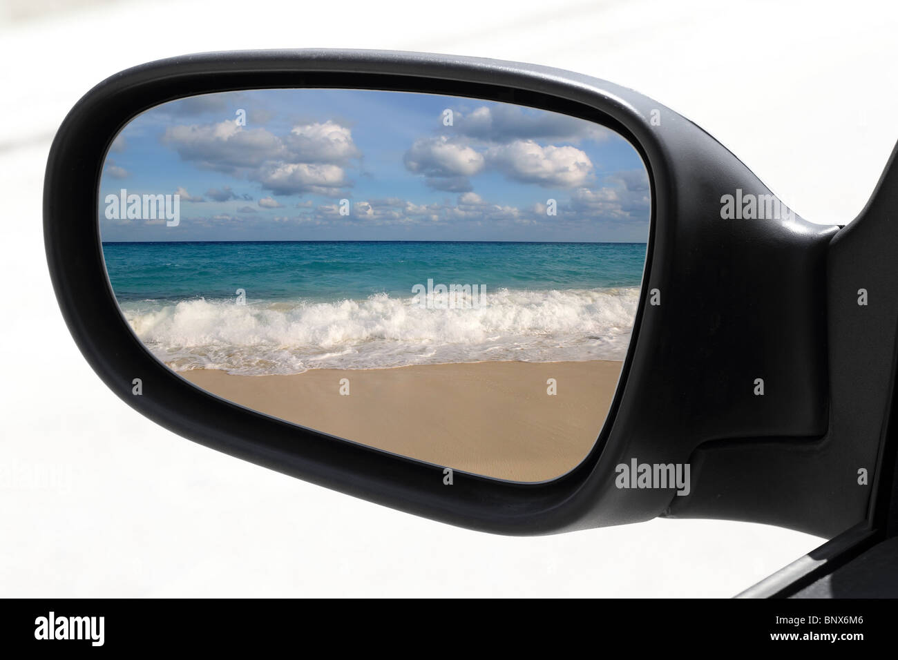 rearview car driving mirror view tropical caribbean sea turquoise beach Stock Photo