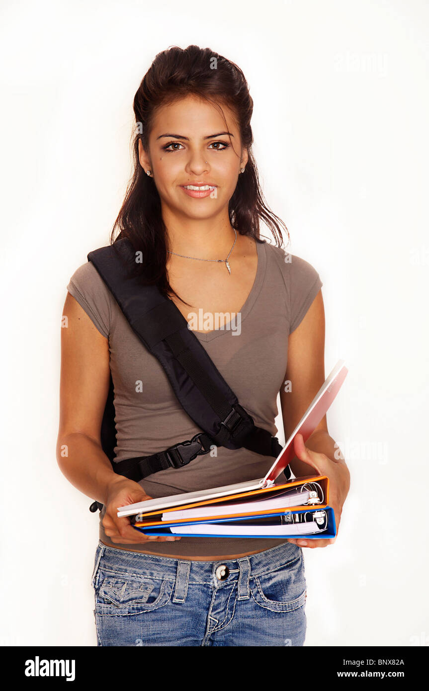 Attractive young female student with backpack and books smiling going ...