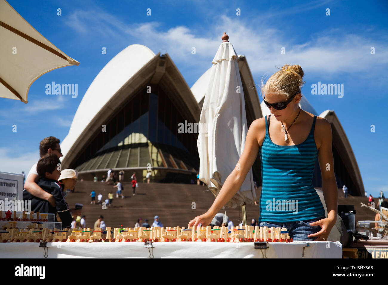 A woman shops at the Sydney Opera House markets - Sydney, New South Wales, AUSTRALIA. Stock Photo