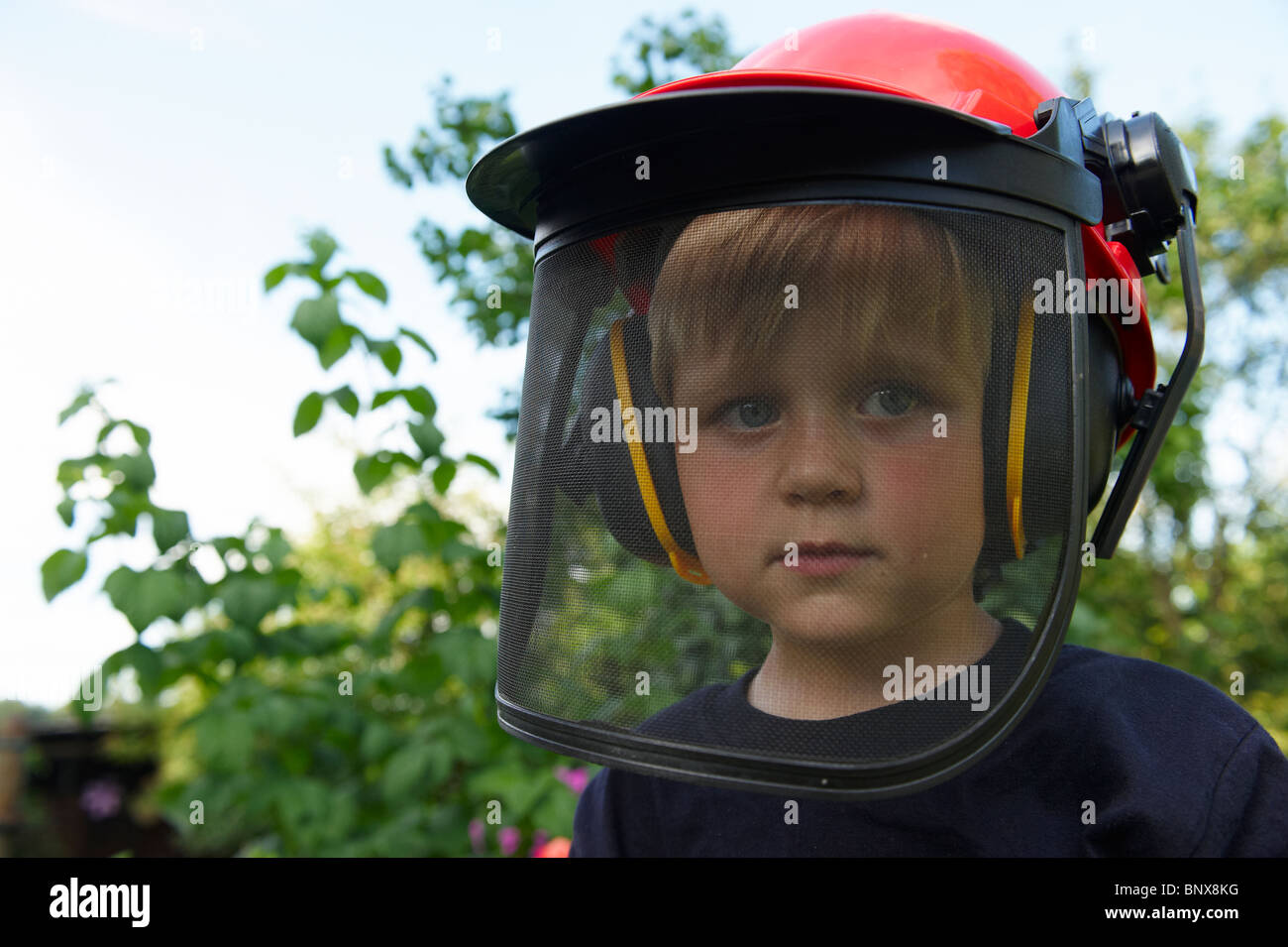 boy with building-site helmet and tools Stock Photo