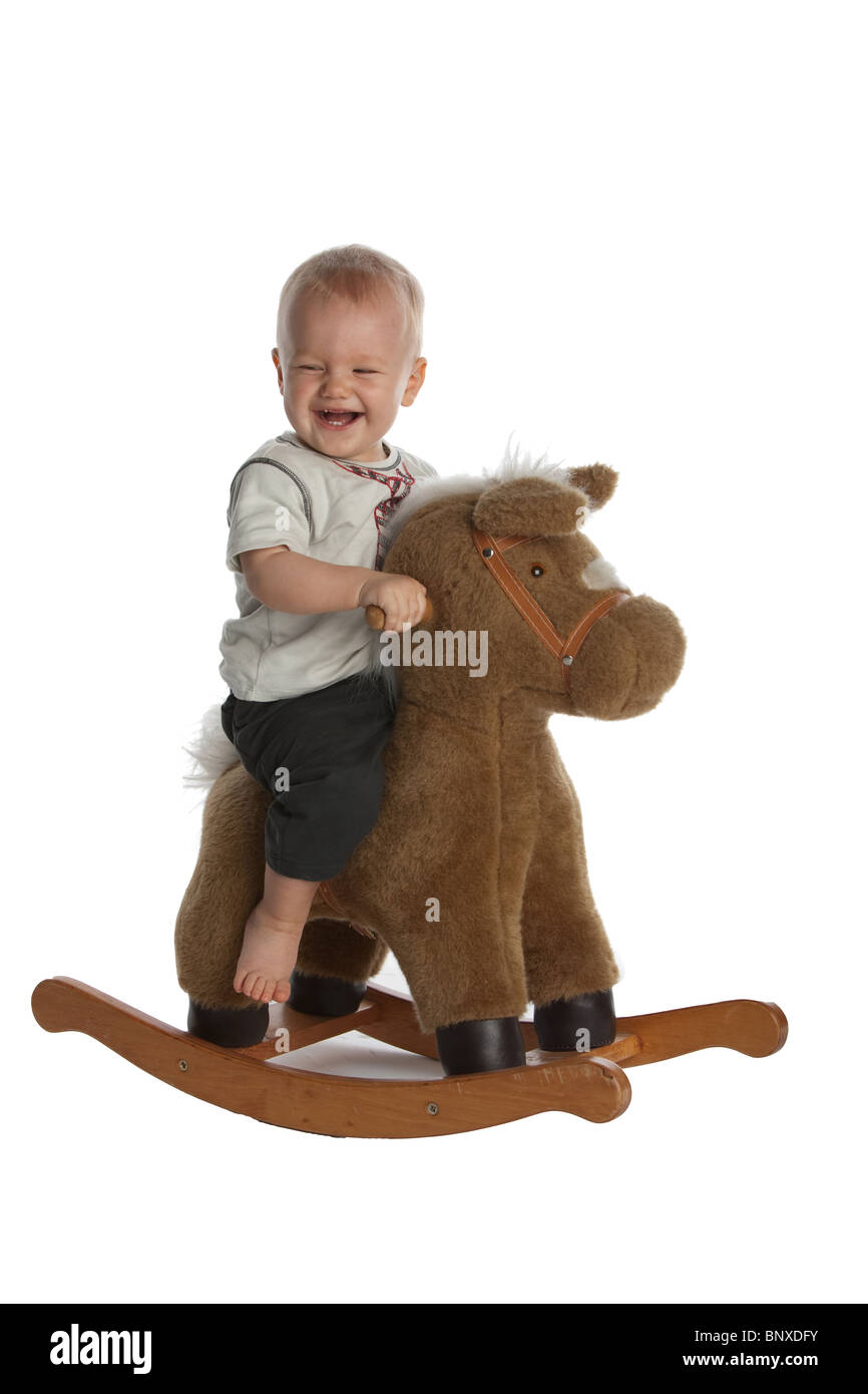 Little Smiling Baby Boy on Rocking Horse Stock Photo - Alamy