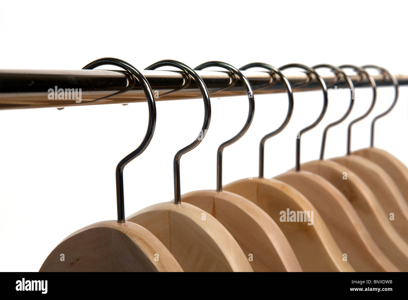 Black Wooden Hangers Hanging On Rack Rail Stock Photo, Picture and Royalty  Free Image. Image 32578781.