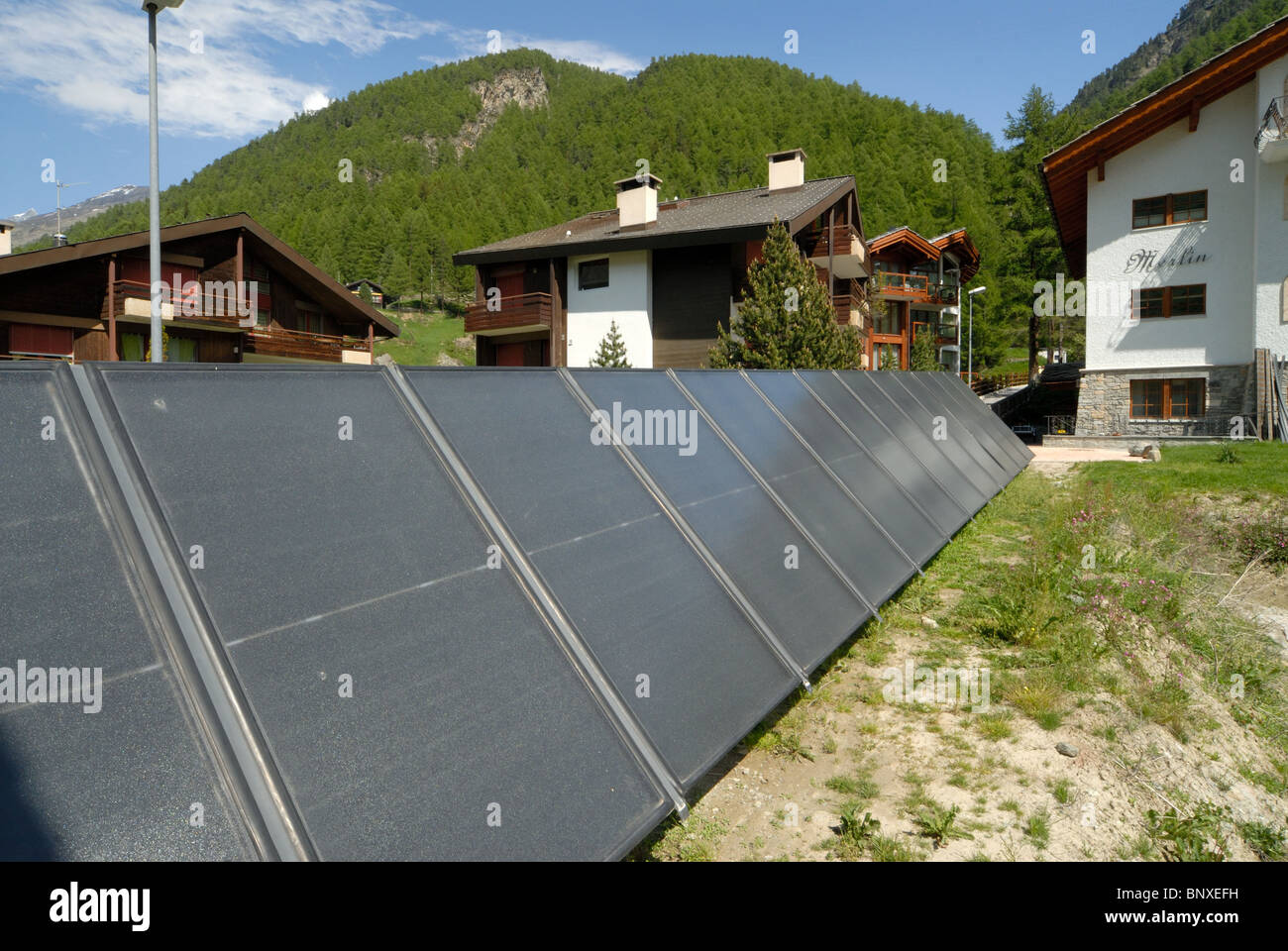 Solar Hot water panels supply hot water to a guest house in Zermatt, Switzerland Stock Photo
