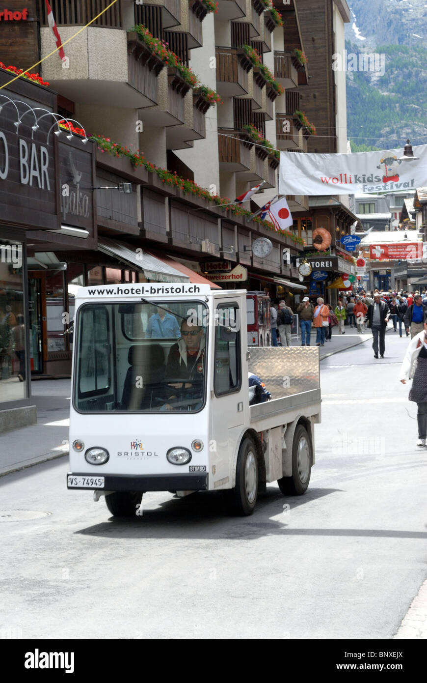Electric vehicles ply Zermatt's streets Stock Photo