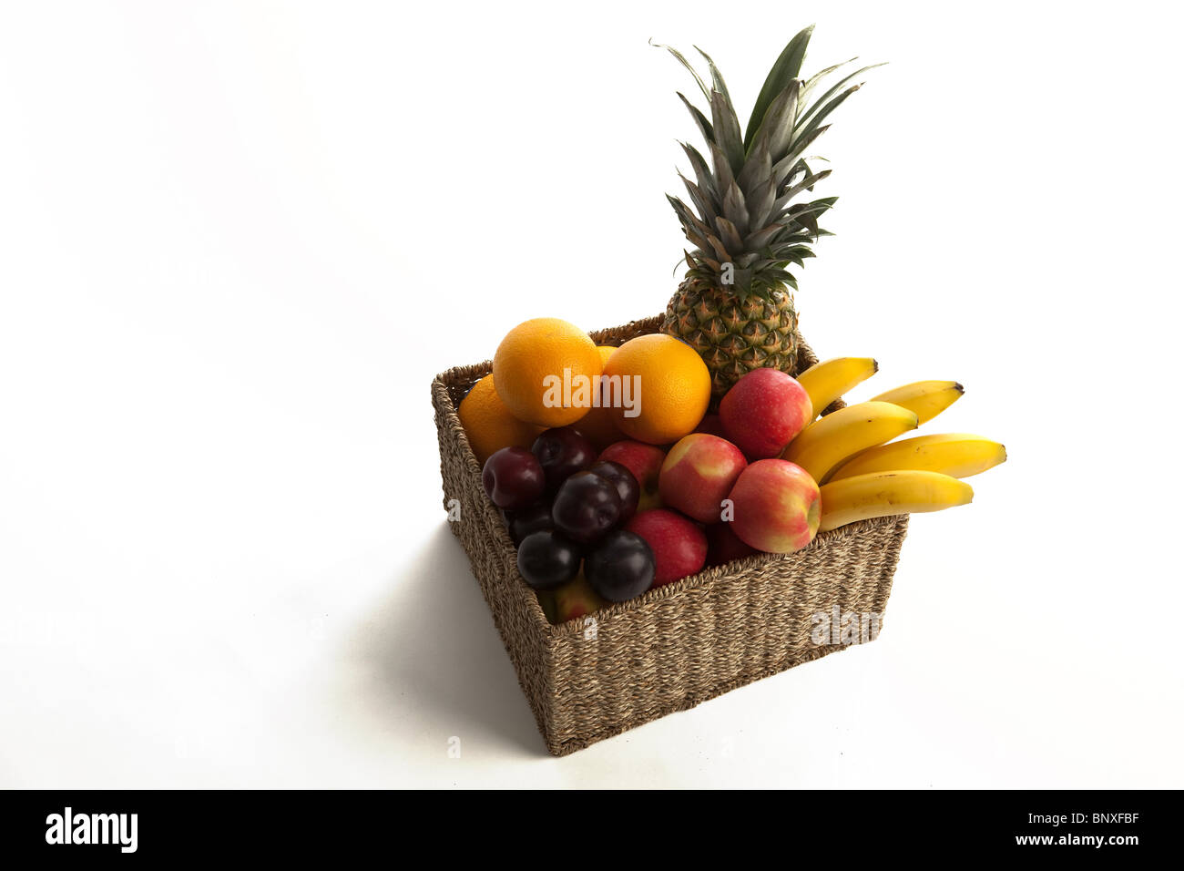 Selection of Fresh Fruits in Basket on White Isolated Background Stock Photo