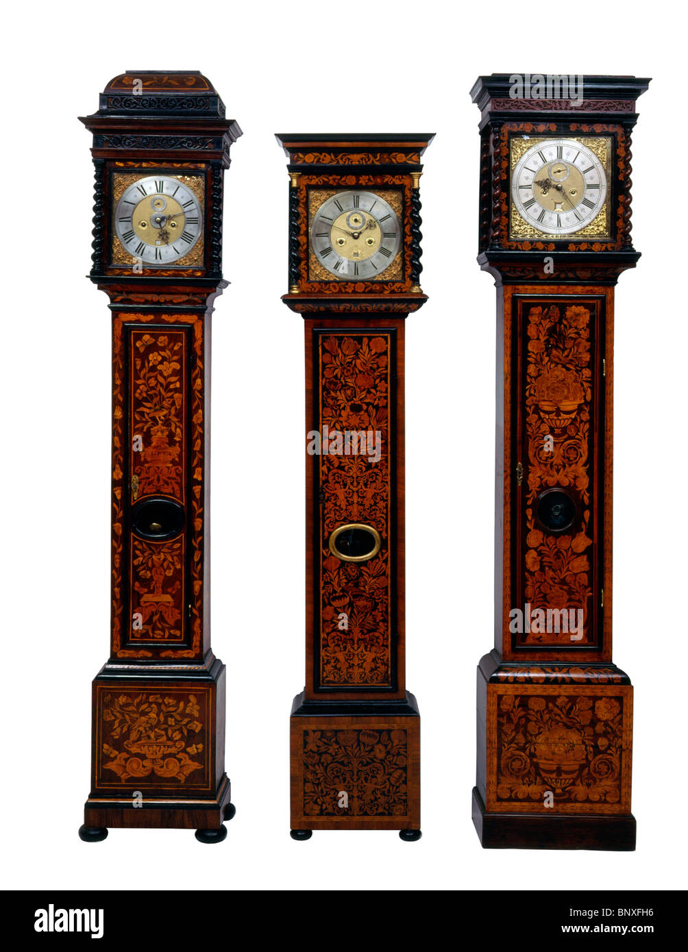 Three English Longcase clocks Stock Photo