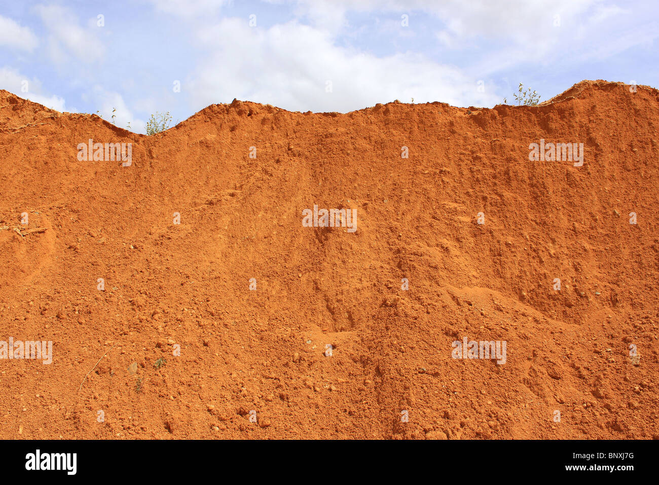 red earth dune of a sand pit Stock Photo
