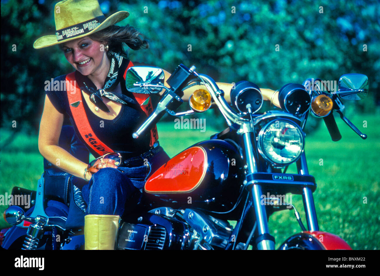 Motorcyclist biker chick straw hat Stock Photo