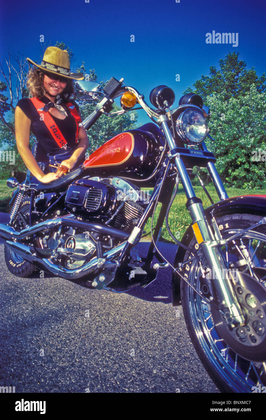 Motorcyclist biker chick straw hat Stock Photo
