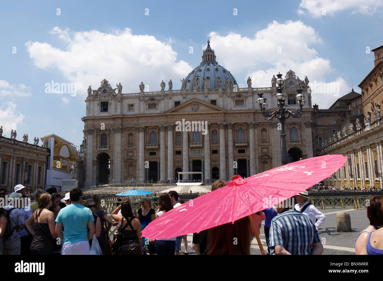 tourists St.Peter square Rome Vatican pink umbrella in first plane Stock Photo Alamy