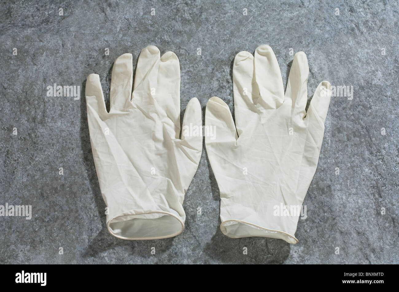 A pair of medical latex rubber gloves Stock Photo