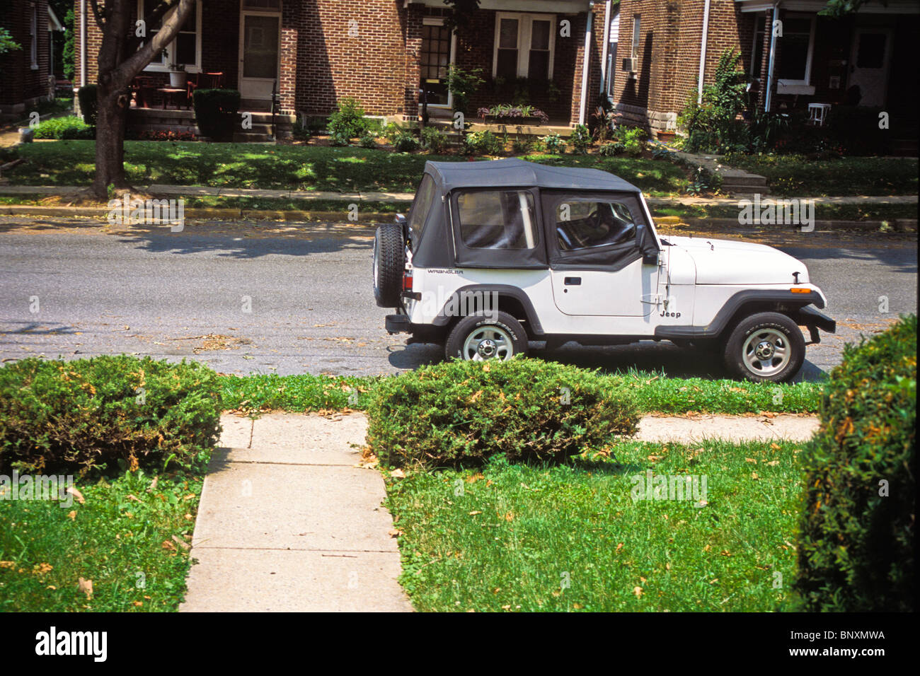 Jeep parks along suburban street Stock Photo Alamy