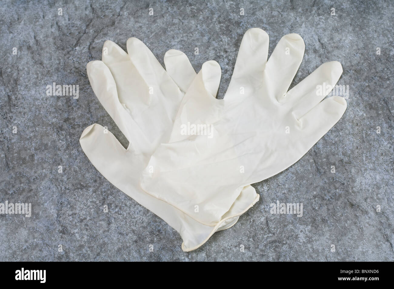 A pair of medical latex rubber gloves Stock Photo
