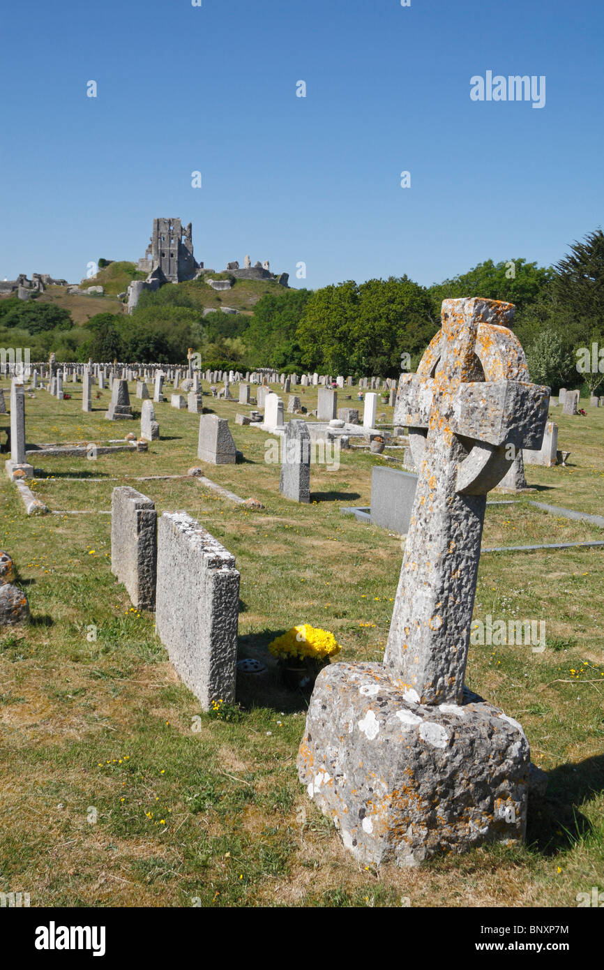 A view of Corfe Castle, Dorset, UK  from a distant cemetery in the village of Corfe Castle, Dorset, UK. Stock Photo