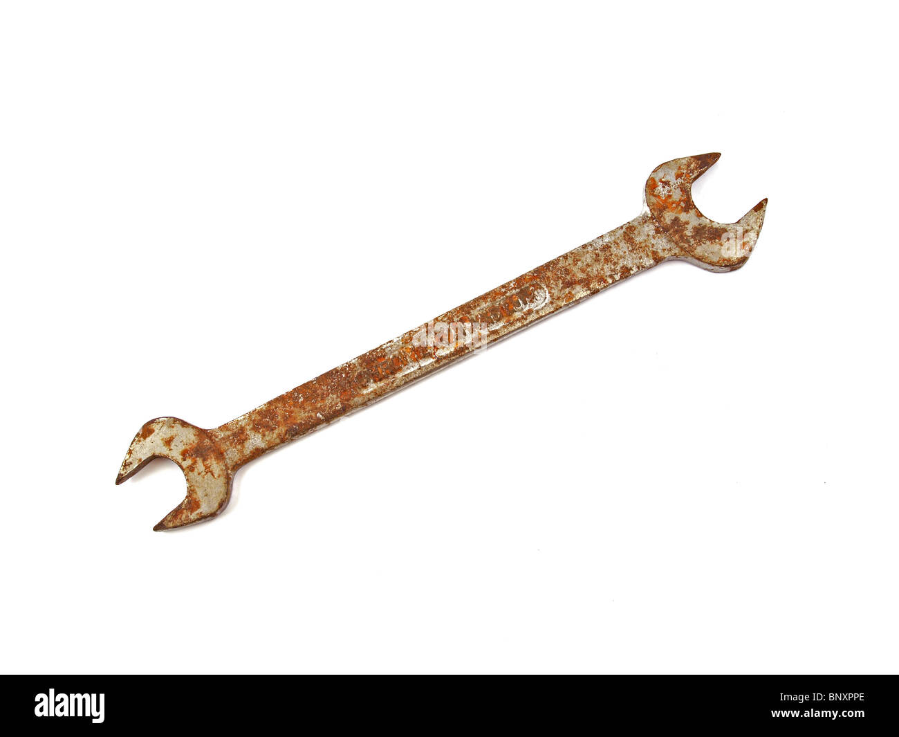 Rusty spanner on a plane white background. Stock Photo
