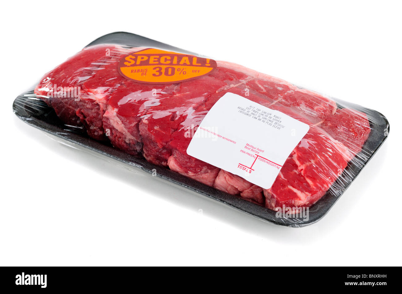 Top Sirloin Steak Roast In A Supermarket Packaging, Isolated On A White