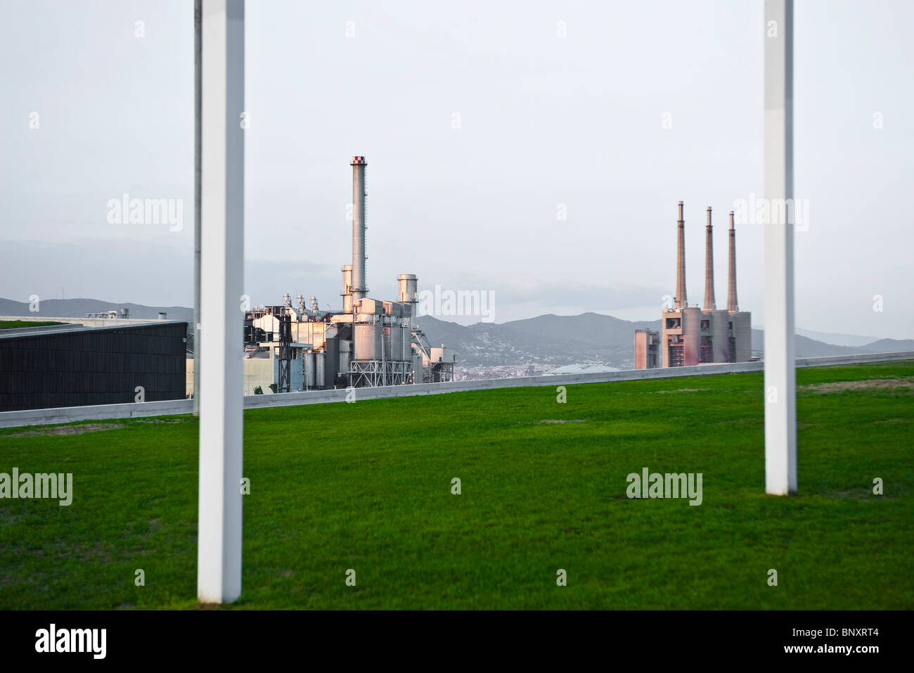 Power station viewed from grasscovered rooftop Stock Photo Alamy