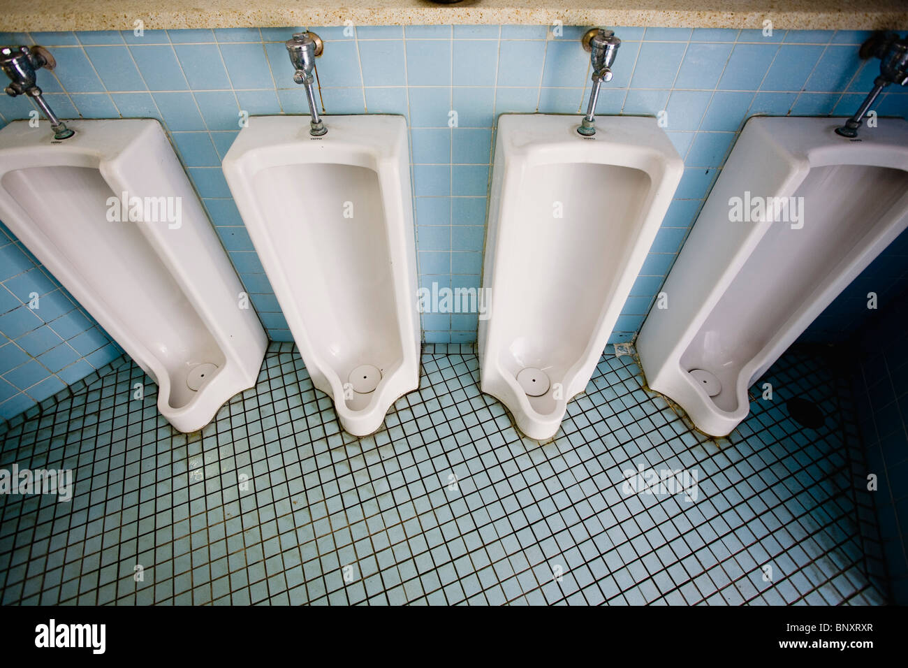 Urinals in public bathroom Stock Photo Alamy