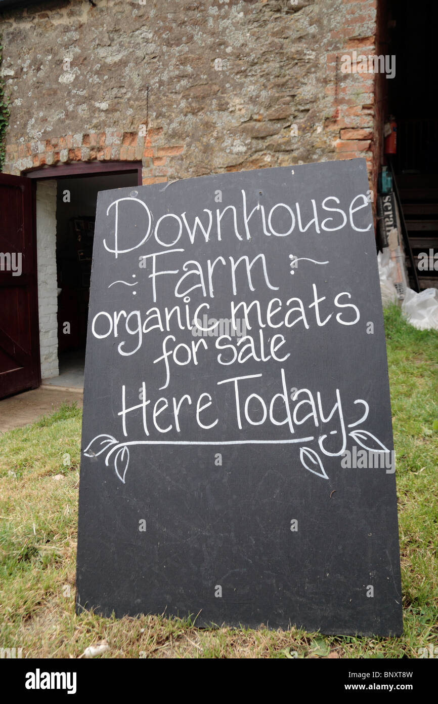 Sign outside Downhouse Farm, an organic farm meats and produce shop in Dorset, UK. Stock Photo