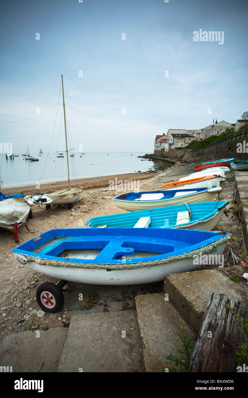 Small boats at Swanage sailing club looking towards Peverell Point, Dorset, Uk Stock Photo