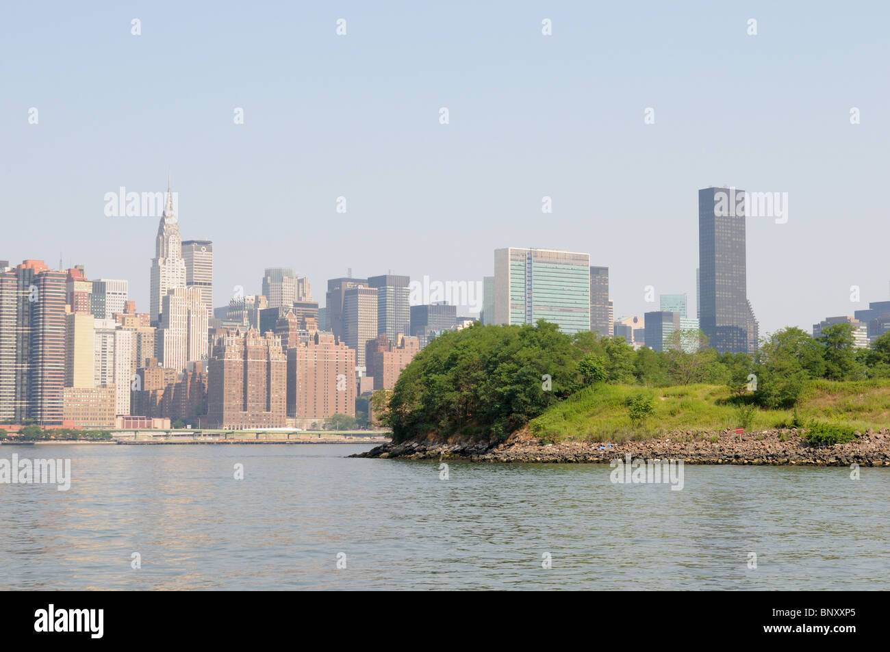 Hunters Point, where polluted Newtown Creek converges with the East River. Midtown Manhattan is in the background. Stock Photo