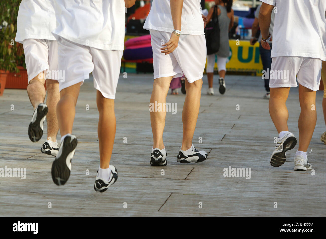 Legs close up boys running in white sportswear clothes Stock Photo - Alamy