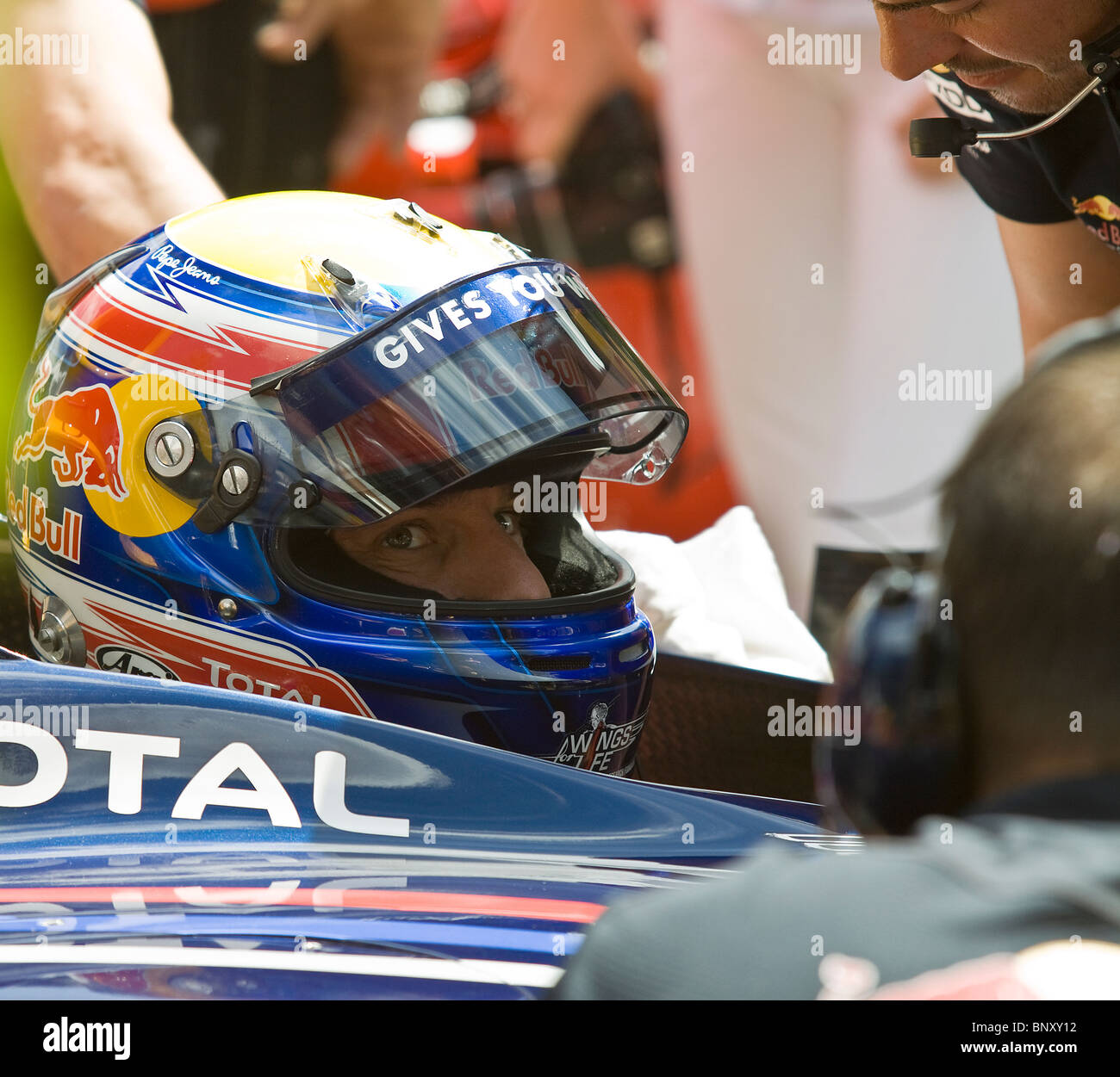 Mark Webber F1 head shot helmet in car Stock Photo