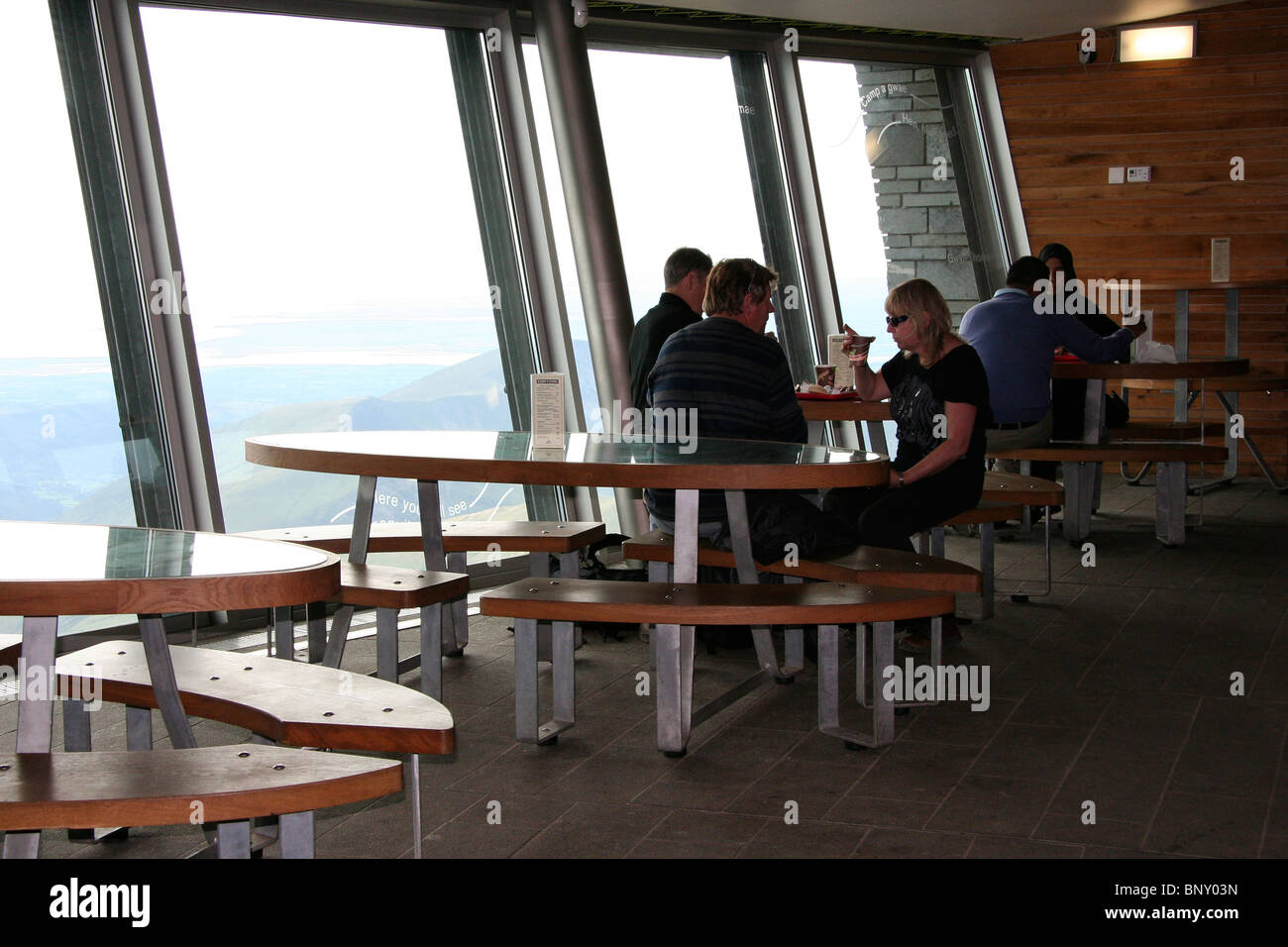 People drinking at Mount Snowdon summit cafe, Snowdonia National Park, North Wales, UK Stock Photo