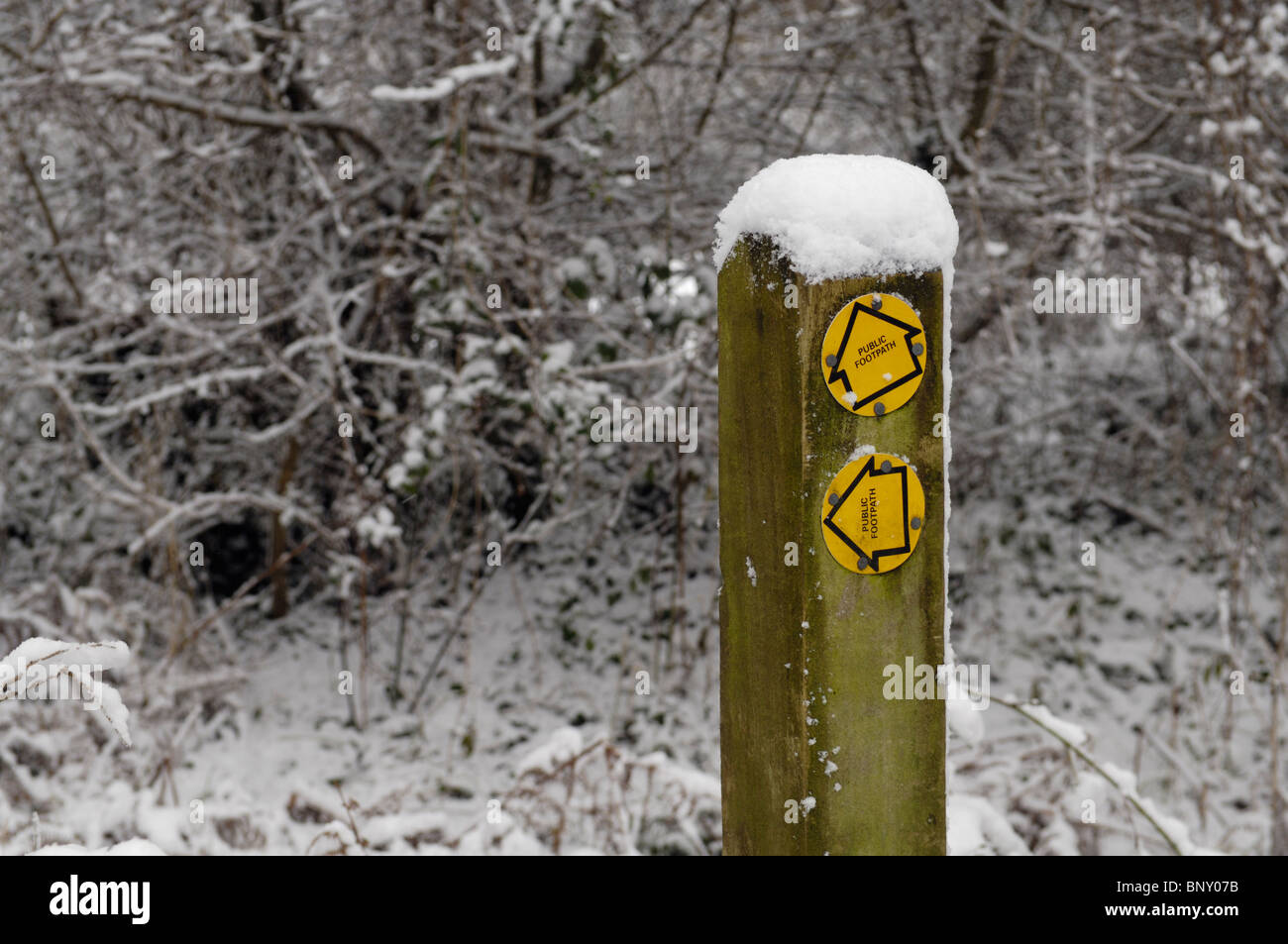 A footpath signpost covered in snow. Redhill, England, Somerset. Stock Photo