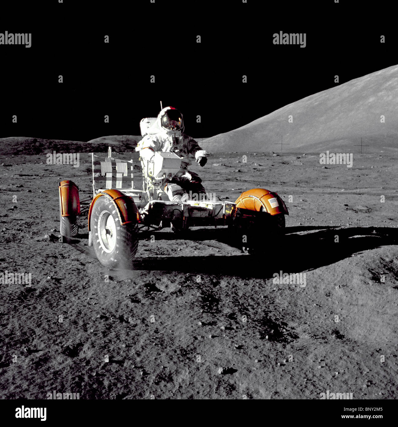 Astronaut Eugene A. Cernan, Apollo 17 mission commander driving the Lunar Roving Vehicle or 'moon buggy' Stock Photo