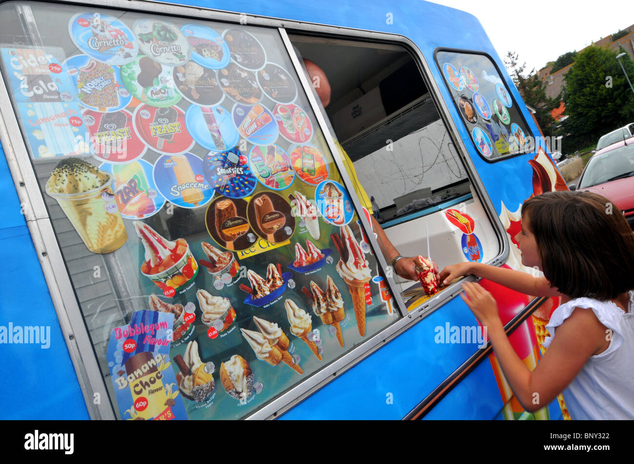 Child buys an “ice cream” from an “ice cream” van, UK Stock Photo